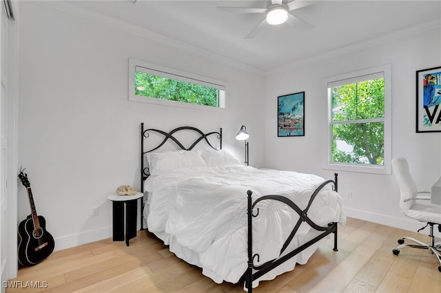 2120 Curtis St, Naples, FL 34112 - bedroom with ornamental molding, multiple windows, light wood-style flooring, and a ceiling fan