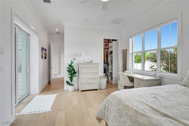 2120 Curtis St, Naples, FL 34112 - bedroom featuring ornamental molding, light wood finished floors, a walk in closet, an office area, and a closet