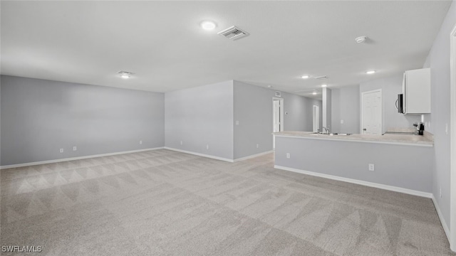 2816 27th St SW, Lehigh Acres, FL 33976 - spare room with light carpet and recessed lighting