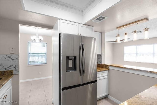 1141 S Alhambra Cir, Naples, FL 34103 - kitchen featuring stainless steel fridge, a chandelier, plenty of natural light, white cabinets, and crown molding