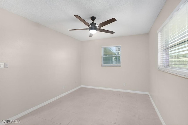 1141 S Alhambra Cir, Naples, FL 34103 - unfurnished room featuring ceiling fan, a textured ceiling, and light tile patterned floors