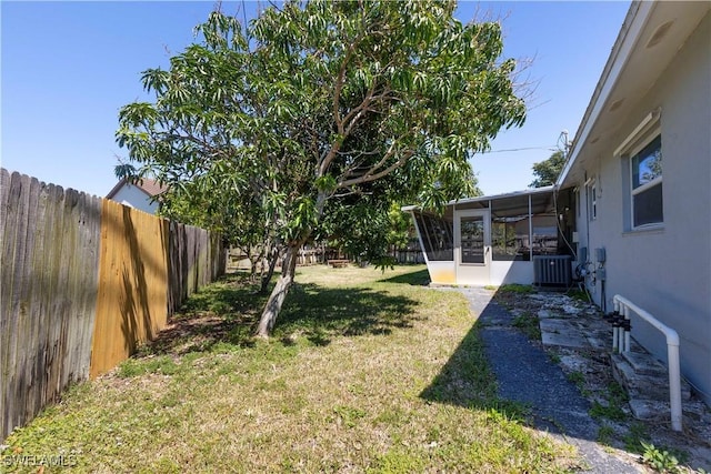 1141 S Alhambra Cir, Naples, FL 34103 - fenced backyard with a sunroom