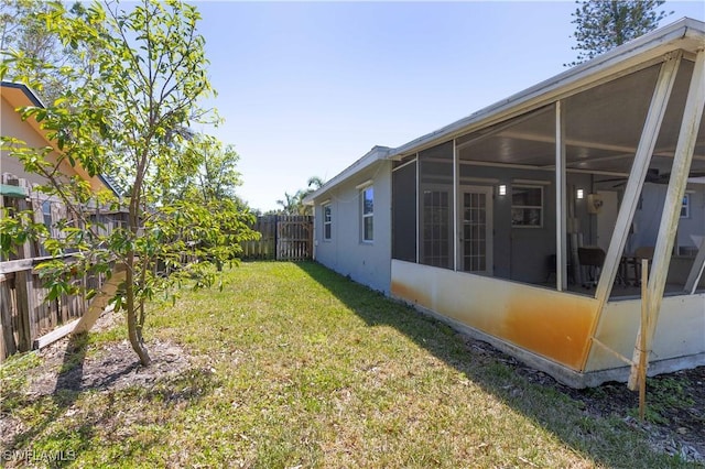 1141 S Alhambra Cir, Naples, FL 34103 - fenced backyard featuring a sunroom