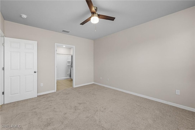 616 Posadas Cir, Punta Gorda, FL 33983 - unfurnished bedroom featuring carpet flooring, a ceiling fan, and ensuite bath