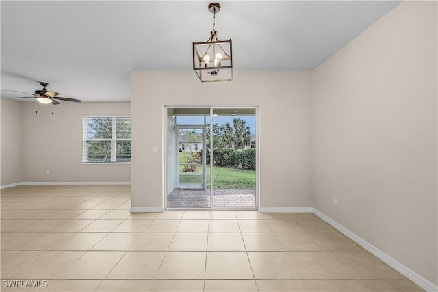 616 Posadas Cir, Punta Gorda, FL 33983 - unfurnished room featuring light tile patterned flooring, a chandelier, and ceiling fan