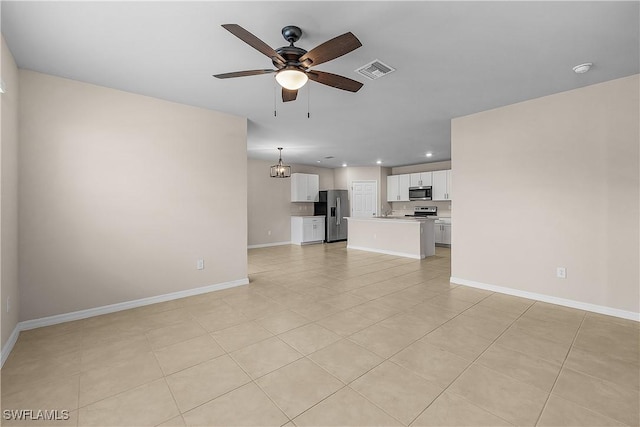 616 Posadas Cir, Punta Gorda, FL 33983 - unfurnished living room with a ceiling fan, recessed lighting, and light tile patterned floors