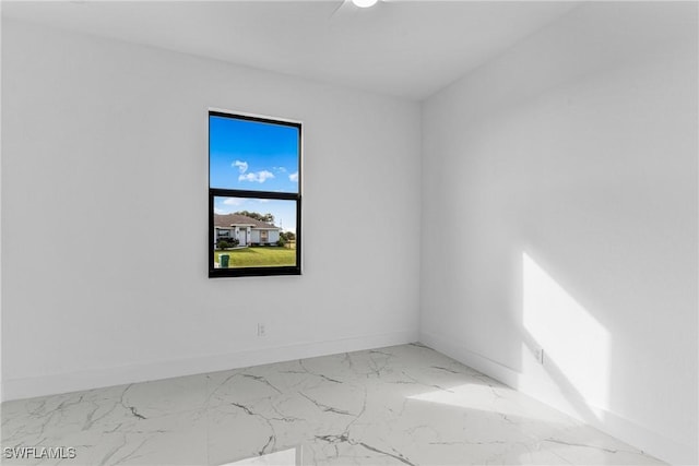 7014 Alfa Cir, Labelle, FL 33935 - spare room featuring baseboards and marble finish flooring