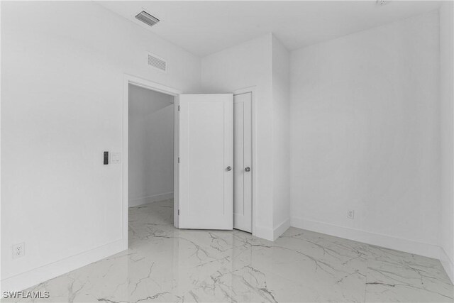 7014 Alfa Cir, Labelle, FL 33935 - empty room with marble finish floors