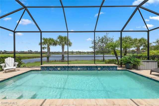 2703 Aviamar Cir, Naples, FL 34114 - swimming pool featuring glass enclosure, a water view, and a patio