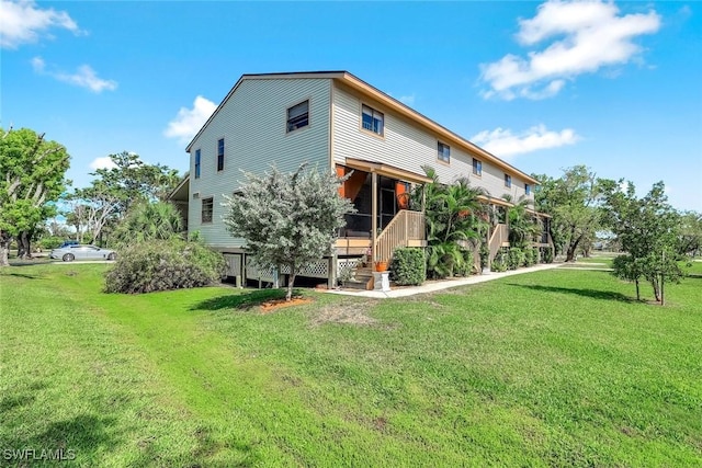 13532 Siesta Pines Ct Unit 5, Fort Myers, FL 33908 - rear view of house featuring a yard