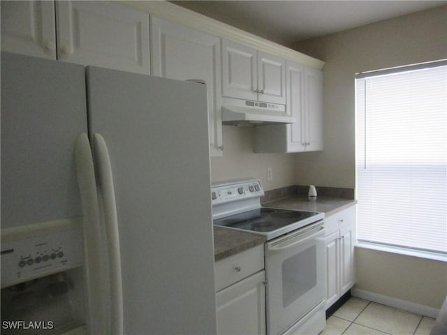 1568/1570 Gilbert Ave S, Lehigh Acres, FL 33973 - kitchen with white appliances, under cabinet range hood, white cabinets, and light tile patterned floors