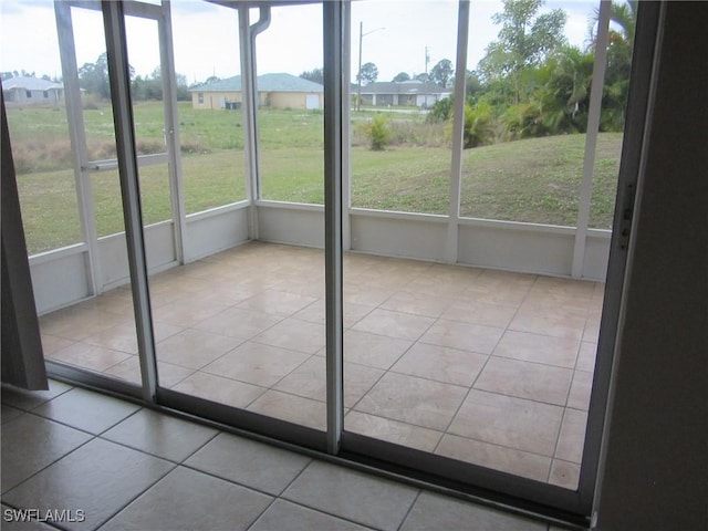 1568/1570 Gilbert Ave S, Lehigh Acres, FL 33973 - unfurnished sunroom featuring plenty of natural light