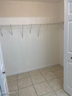 1568/1570 Gilbert Ave S, Lehigh Acres, FL 33973 - walk in closet with light tile patterned flooring