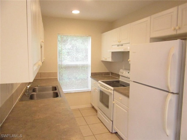 1568/1570 Gilbert Ave S, Lehigh Acres, FL 33973 - kitchen with white appliances, under cabinet range hood, white cabinetry, plenty of natural light, and recessed lighting