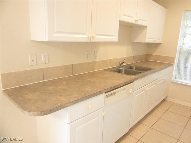 1568/1570 Gilbert Ave S, Lehigh Acres, FL 33973 - kitchen featuring white dishwasher, white cabinets, light tile patterned flooring, and light countertops