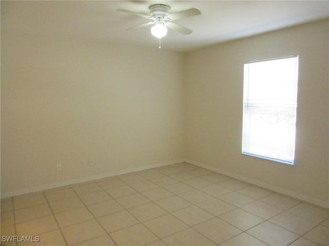 1568/1570 Gilbert Ave S, Lehigh Acres, FL 33973 - empty room featuring plenty of natural light and ceiling fan