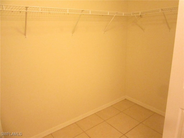 1568/1570 Gilbert Ave S, Lehigh Acres, FL 33973 - walk in closet with light tile patterned floors
