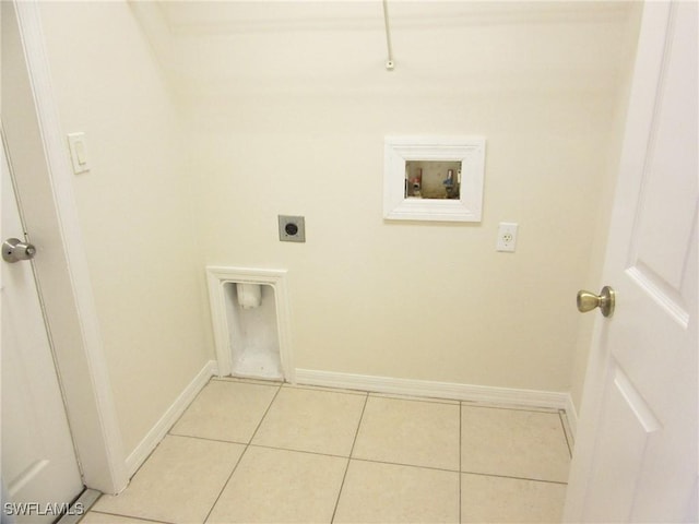1568/1570 Gilbert Ave S, Lehigh Acres, FL 33973 - washroom with hookup for an electric dryer, hookup for a washing machine, and light tile patterned flooring
