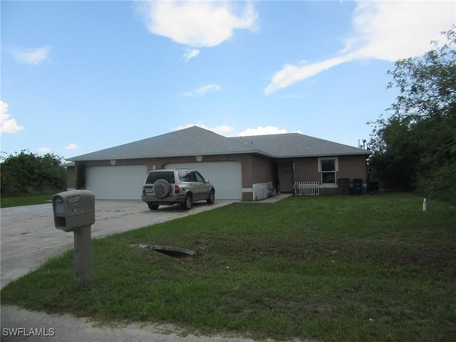 1568/1570 Gilbert Ave S, Lehigh Acres, FL 33973 - ranch-style home with driveway, an attached garage, and a front yard
