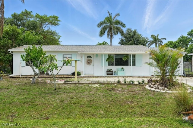 4011 Coconut Cir S, Naples, FL 34104 - single story home featuring a front lawn and stucco siding