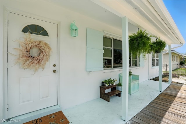 4011 Coconut Cir S, Naples, FL 34104 - property entrance with covered porch and stucco siding