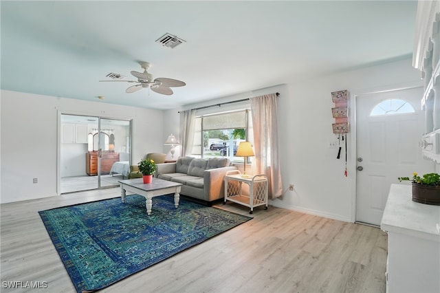 4011 Coconut Cir S, Naples, FL 34104 - living area with light wood-style flooring and a ceiling fan