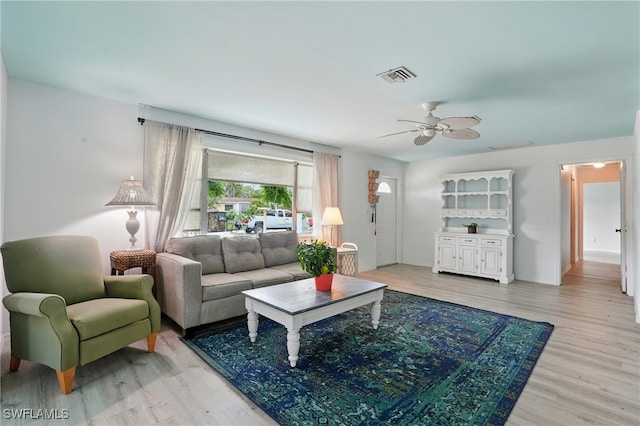 4011 Coconut Cir S, Naples, FL 34104 - living area with light wood-style flooring and a ceiling fan