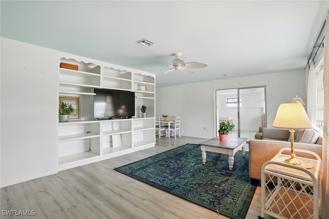 4011 Coconut Cir S, Naples, FL 34104 - living area featuring wood finished floors and ceiling fan