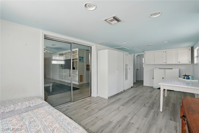 4011 Coconut Cir S, Naples, FL 34104 - kitchen featuring light wood-style flooring, white cabinets, fridge, recessed lighting, and a ceiling fan