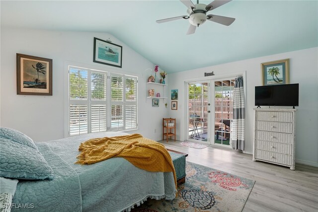 4011 Coconut Cir S, Naples, FL 34104 - bedroom featuring access to exterior, french doors, wood finished floors, vaulted ceiling, and ceiling fan