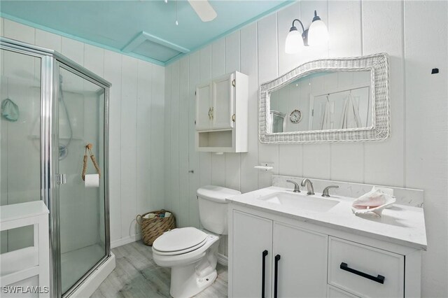 4011 Coconut Cir S, Naples, FL 34104 - full bath with a shower stall, vanity, and wood finished floors