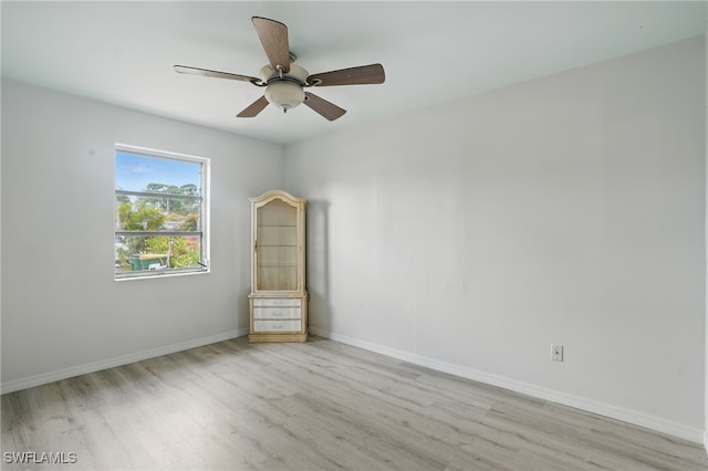 4011 Coconut Cir S, Naples, FL 34104 - unfurnished room featuring wood finished floors and a ceiling fan