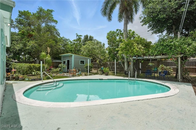 4011 Coconut Cir S, Naples, FL 34104 - view of pool with a patio area, a fenced backyard, and an outdoor structure