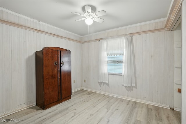 4011 Coconut Cir S, Naples, FL 34104 - unfurnished bedroom with wood finished floors, crown molding, and a ceiling fan