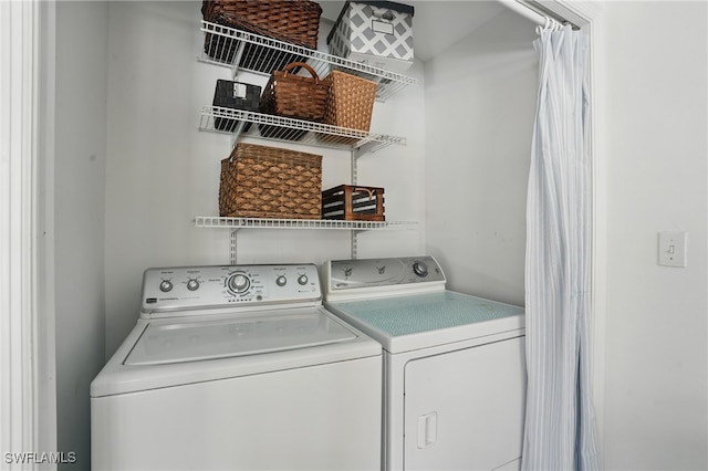 4011 Coconut Cir S, Naples, FL 34104 - laundry room featuring separate washer and dryer