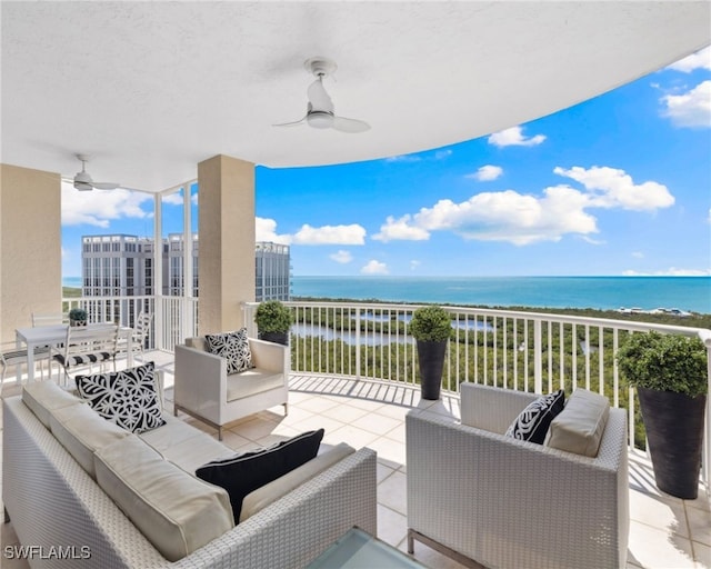 7117 Pelican Bay Blvd Unit 1903, Naples, FL 34108 - balcony featuring a ceiling fan, an outdoor living space, and a water view