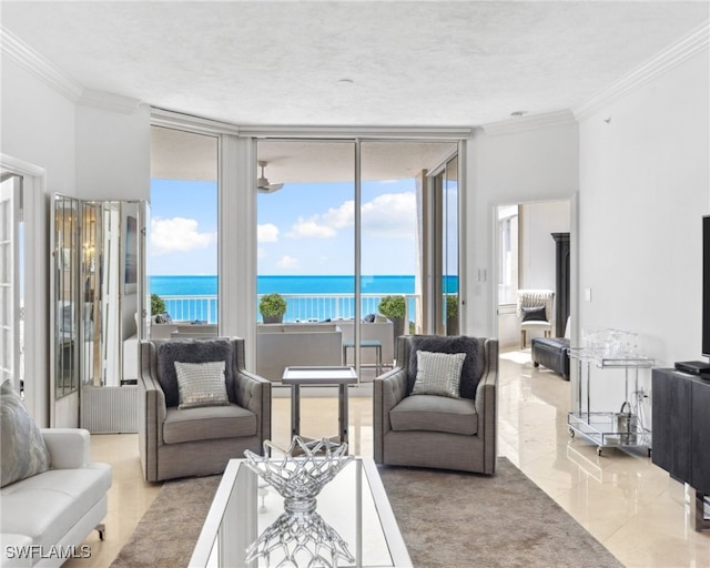 7117 Pelican Bay Blvd Unit 1903, Naples, FL 34108 - living room featuring a wall of windows, a water view, crown molding, and plenty of natural light
