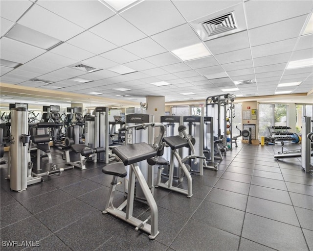 7117 Pelican Bay Blvd Unit 1903, Naples, FL 34108 - exercise room with a drop ceiling
