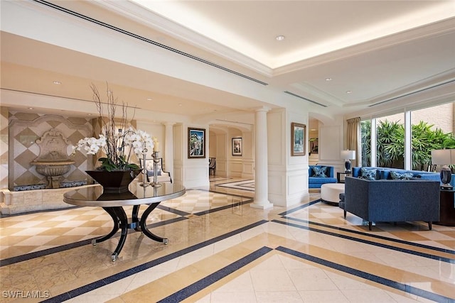 7117 Pelican Bay Blvd Unit 1903, Naples, FL 34108 - community lobby featuring recessed lighting, crown molding, and a decorative wall