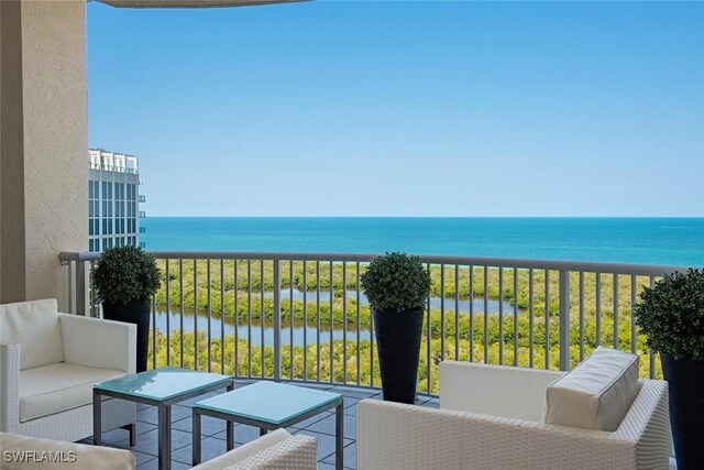 7117 Pelican Bay Blvd Unit 1903, Naples, FL 34108 - balcony featuring a water view and outdoor lounge area