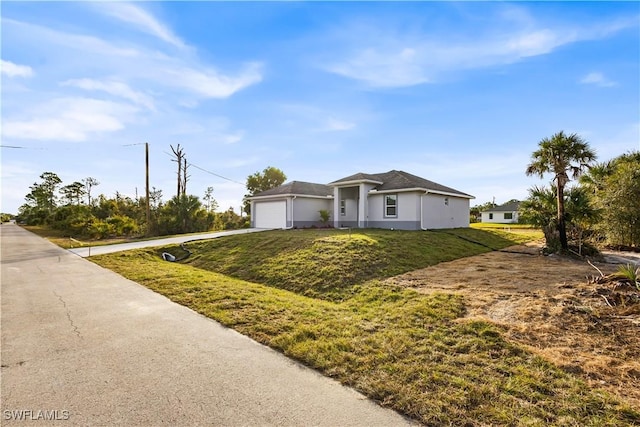 210 Aurora Ave S, Lehigh Acres, FL 33974 - single story home featuring concrete driveway, an attached garage, and a front yard