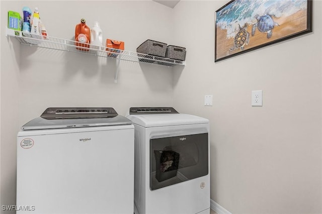 1700 SW 3rd St, Cape Coral, FL 33991 - laundry area with washer and clothes dryer and baseboards