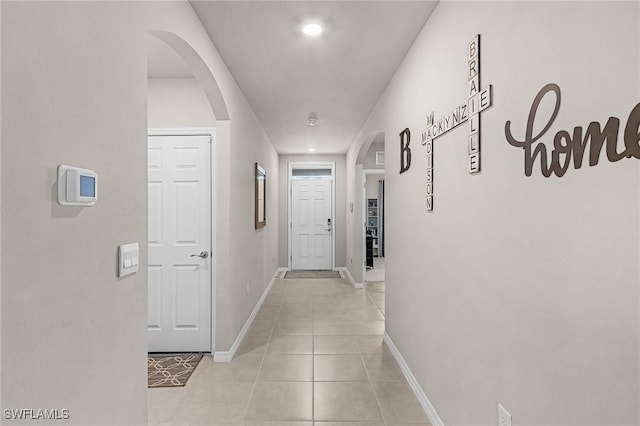 1700 SW 3rd St, Cape Coral, FL 33991 - corridor featuring light tile patterned floors and arched walkways