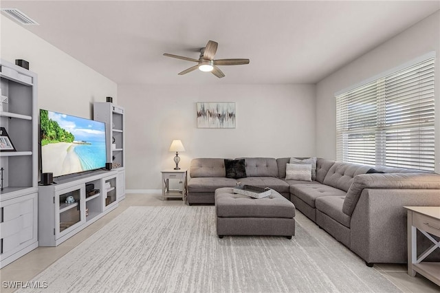 1700 SW 3rd St, Cape Coral, FL 33991 - living area with a ceiling fan and baseboards