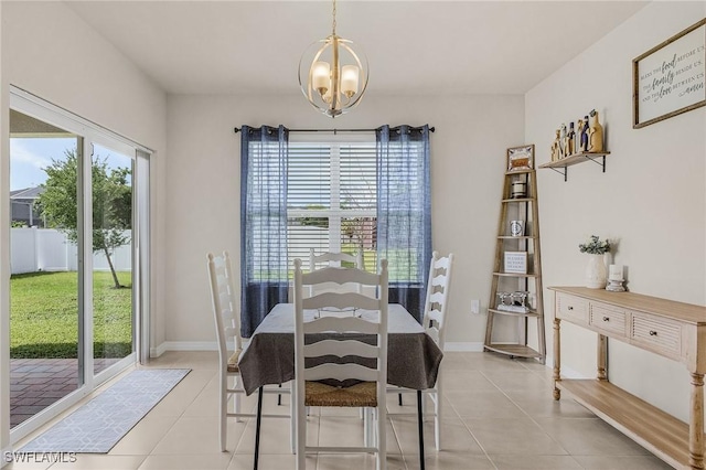 1700 SW 3rd St, Cape Coral, FL 33991 - dining area with a chandelier, plenty of natural light, and light tile patterned floors