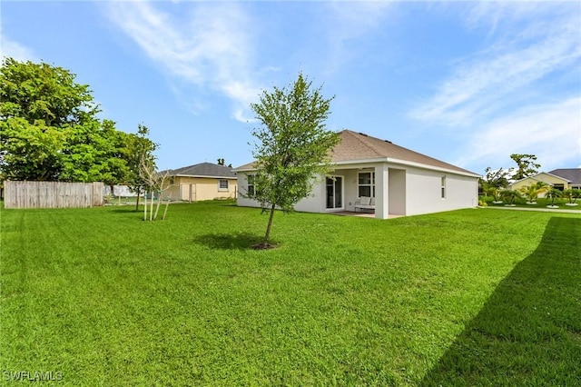 1700 SW 3rd St, Cape Coral, FL 33991 - rear view of house with stucco siding