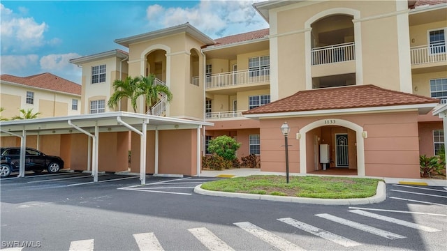 1133 Van Loon Commons Cir Unit 202, Cape Coral, FL 33909 - view of building exterior with covered parking