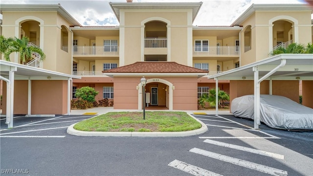 1133 Van Loon Commons Cir Unit 202, Cape Coral, FL 33909 - view of building exterior with covered parking
