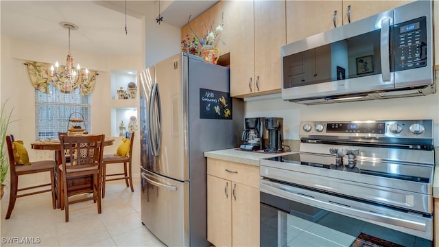 1133 Van Loon Commons Cir Unit 202, Cape Coral, FL 33909 - kitchen with appliances with stainless steel finishes, a chandelier, light tile patterned floors, light countertops, and light brown cabinets