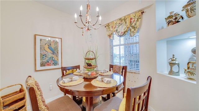 1133 Van Loon Commons Cir Unit 202, Cape Coral, FL 33909 - dining space featuring a chandelier and baseboards